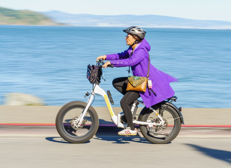 Senior rider on a step-through electric bike